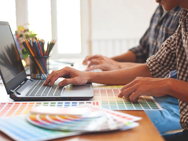 a designer working at a computer